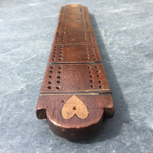 An Early 19th Century Folk Art Cribbage Board