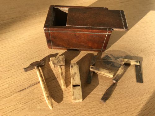An Antique Box with Miniature Carpentry Tools