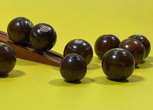 a complete set of mini lignum vitae bowls jack - CATEGORY: ANTIQUE MISCELLANEOUS - DATED 1900