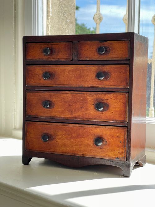 an early 1800s mini chest of drawers fruitwood - CATEGORY: ANTIQUE CHEST OF DRAWERS - DATED GEORGIAN