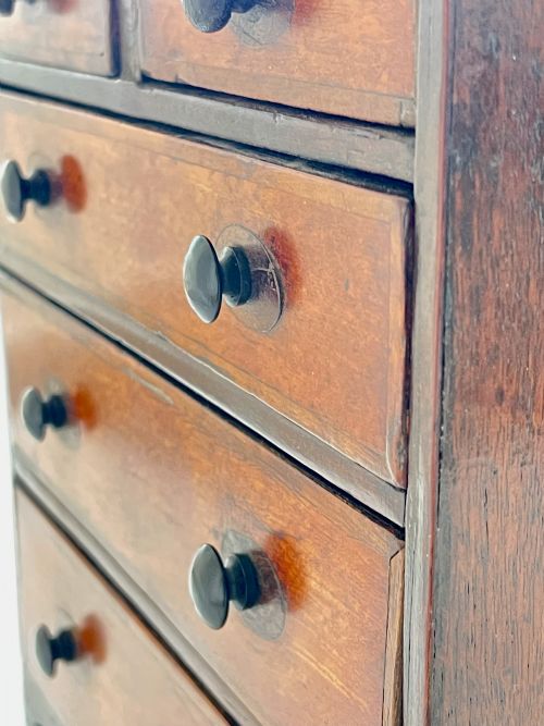 AN EARLY 1800S MINI CHEST OF DRAWERS FRUITWOOD - ADDITIONAL PHOTO 1
