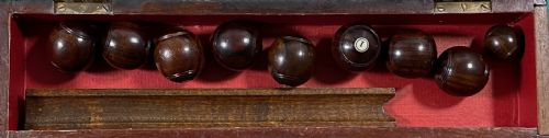ANTIQUE TREEN TABLE BOWLS IN A MAHOGANY BOX COMPLETE WITH RULES - ADDITIONAL PHOTO 2