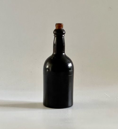 an unusual antique treen go to bed shaped as a wine bottle - CATEGORY: ANTIQUE GLASS - DATED 19TH CENTURY