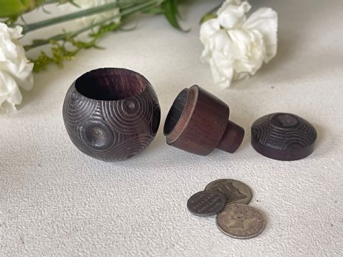 A MINI ANTIQUE TREEN PUZZLE BALL WITH THREE OLD COINS INSIDE - ADDITIONAL PHOTO 2
