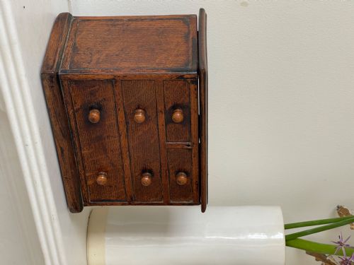 AN ANTIQUE OAK BOX IN THE FORM OF A MINI CHEST OF DRAWERS - ADDITIONAL PHOTO 3