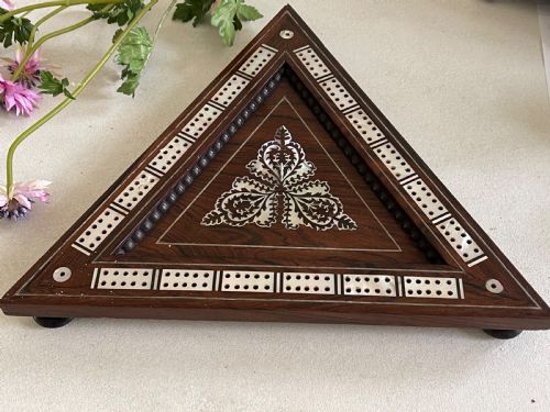 an antique triangular cribbage board - CATEGORY: ANTIQUE MISCELLANEOUS - DATED VICTORIAN