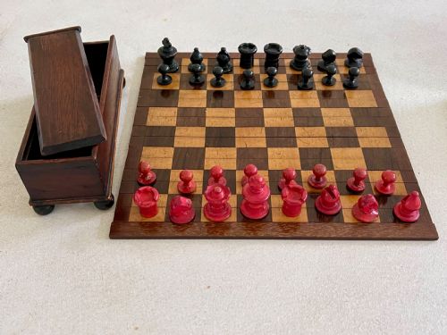 a small roll up chess board boxed chess pieces - CATEGORY: ANTIQUE MISCELLANEOUS - DATED 19TH CENTURY