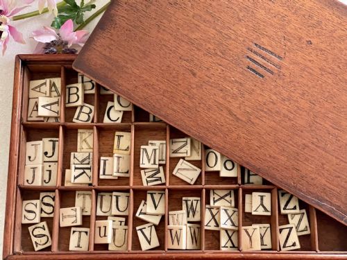 AN ANTIQUE ALPHABET BOX WITH MAKERS NAME