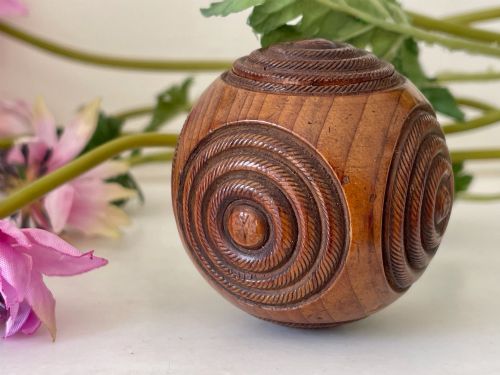 AN ANTIQUE TREEN IRISH PUZZLE BALL