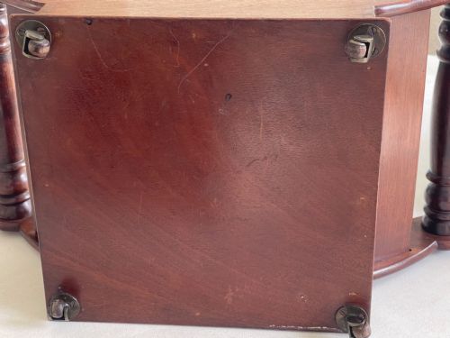 fig 1. A curved Georgian mahogany cheese coaster with turned end handles and small brass castors on the base.