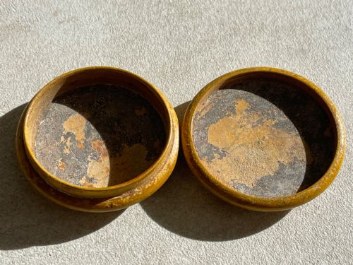 fig 3. A circular yellow wooden antique Scottish snuff box with a printed love poem on the top lid.