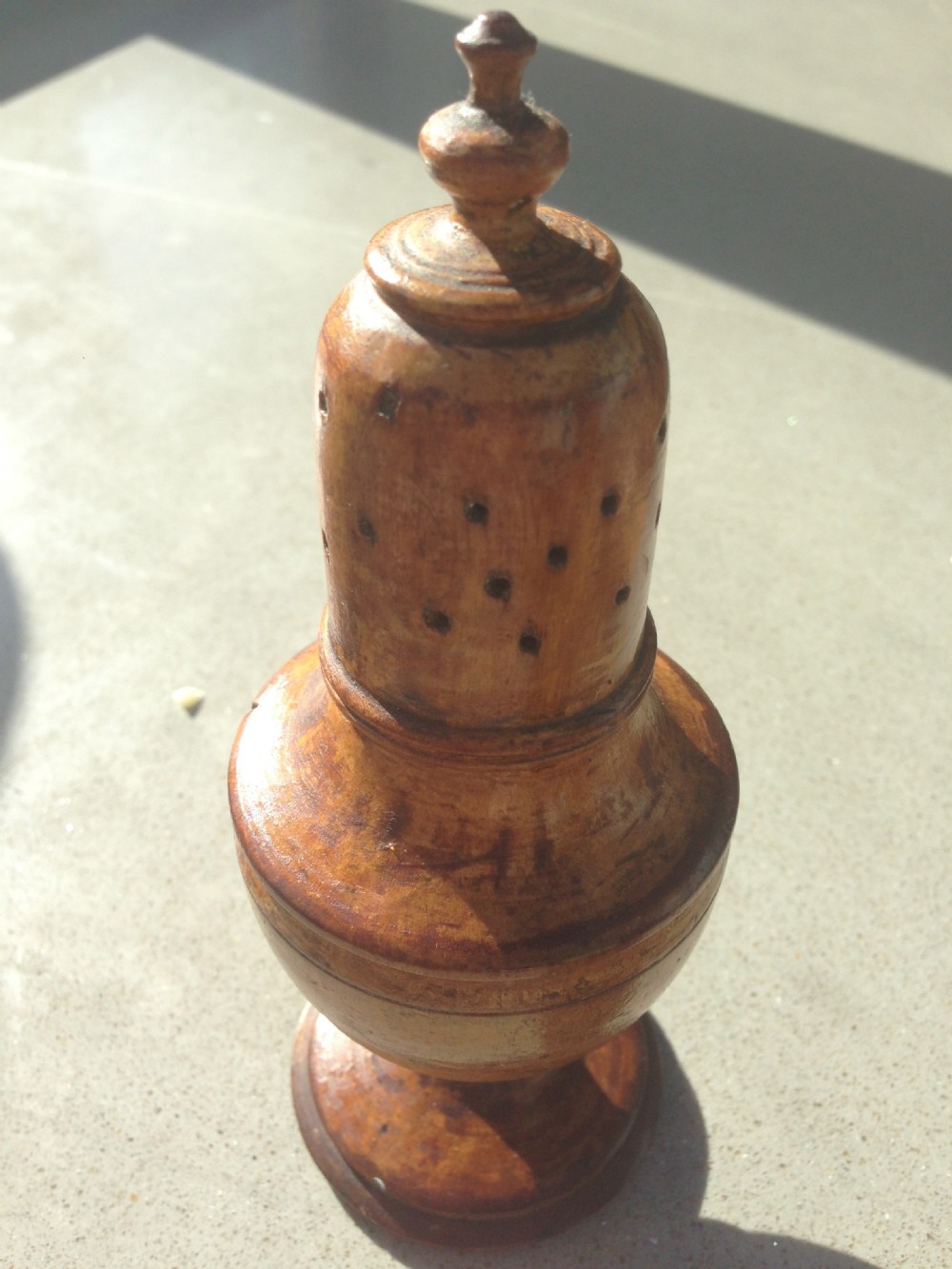 An antique  spice muffineer