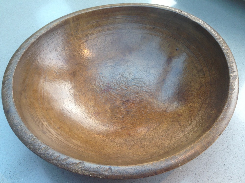 An antique sycamore dairy bowl