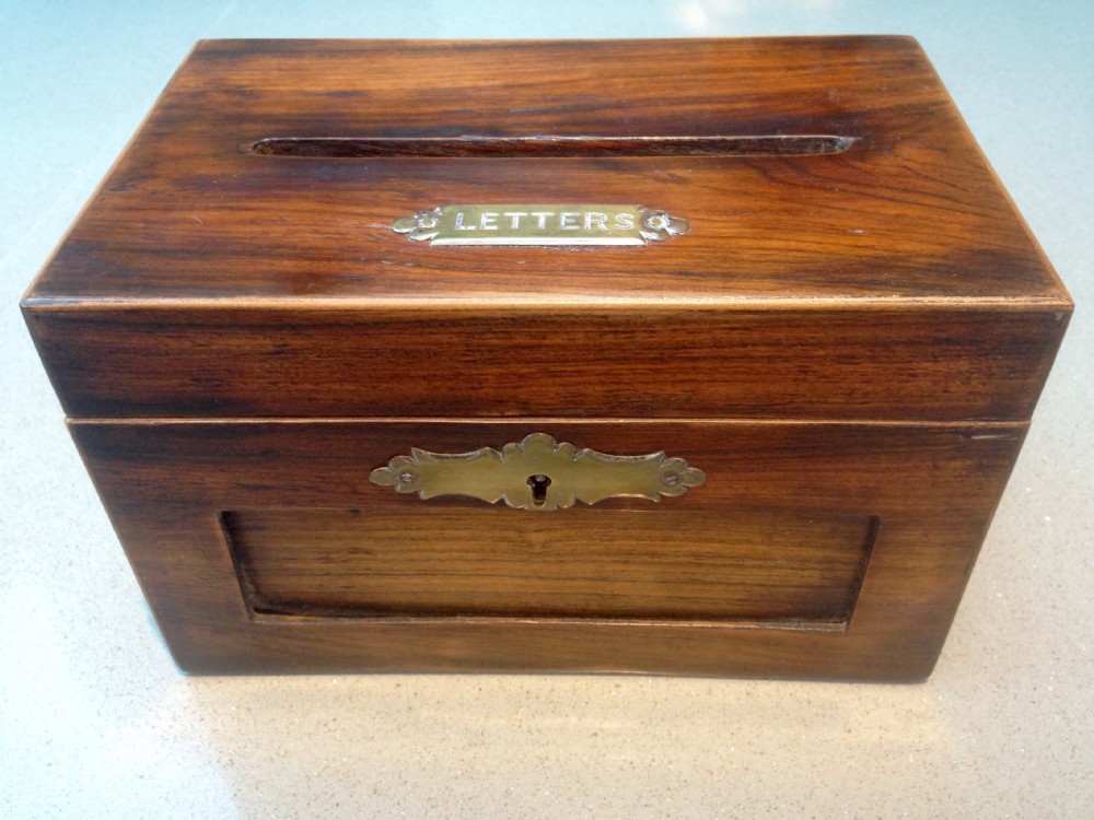 An Edwardian rosewood letter box