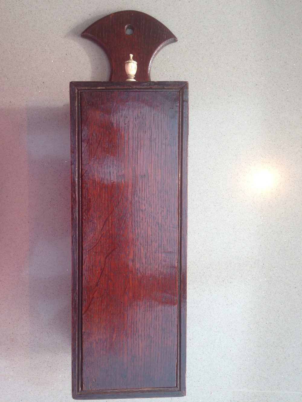 A late 18th century oak candle box