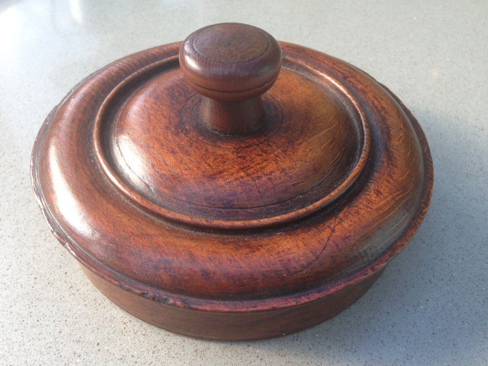An antique t spice box with screw top lid