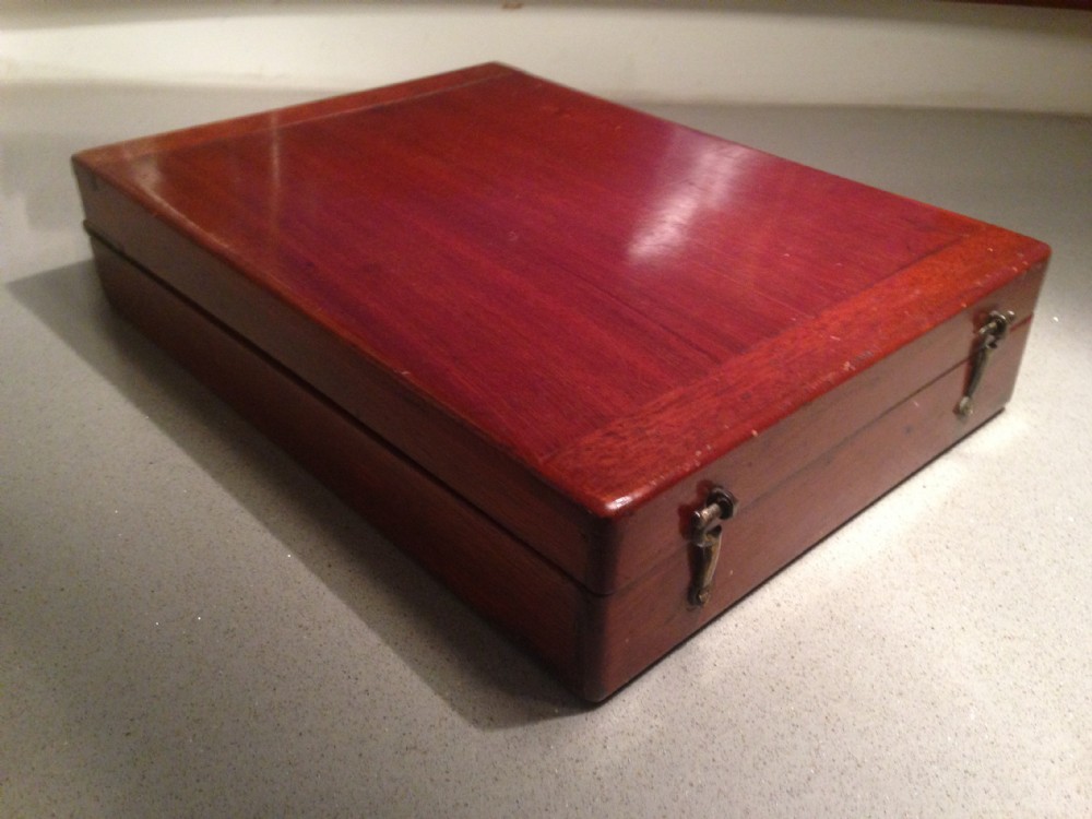 An antique mahogany mini bagatelle game