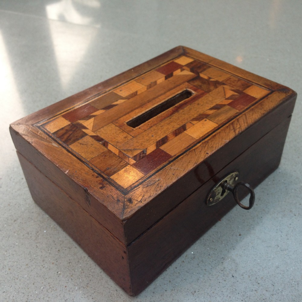 An early 19th century inlaid money box