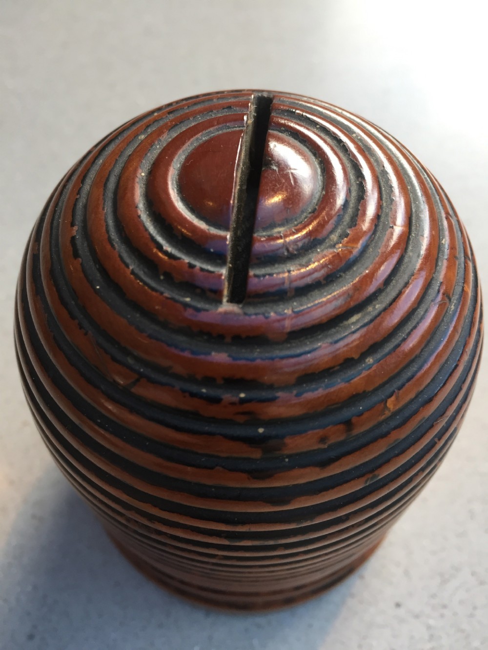 An Antique Money Box in the shape of a Bee Hive