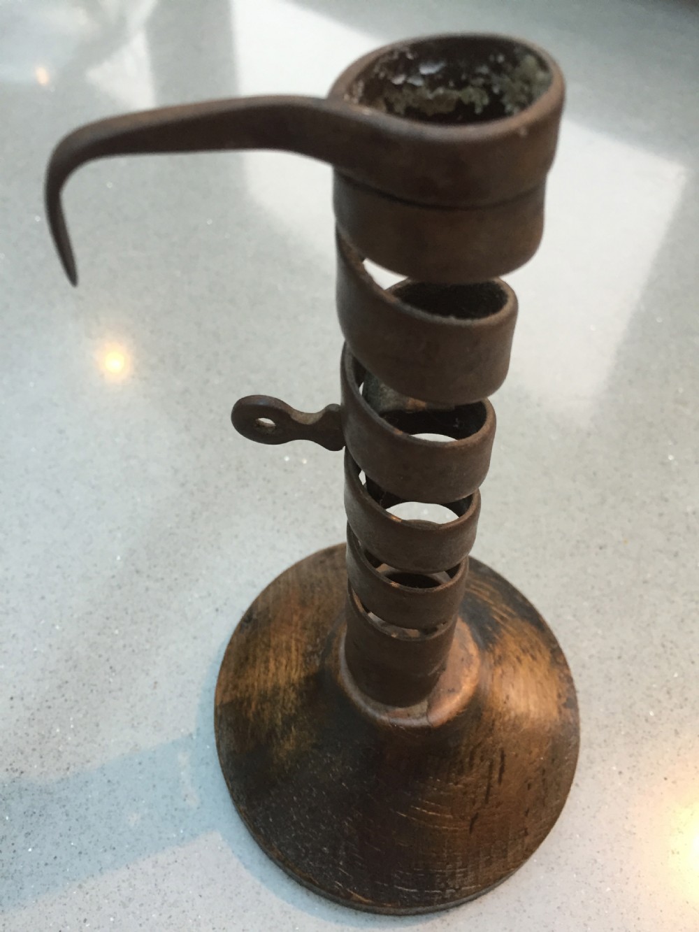 A late 18th century spiral candlestick on its original wood base