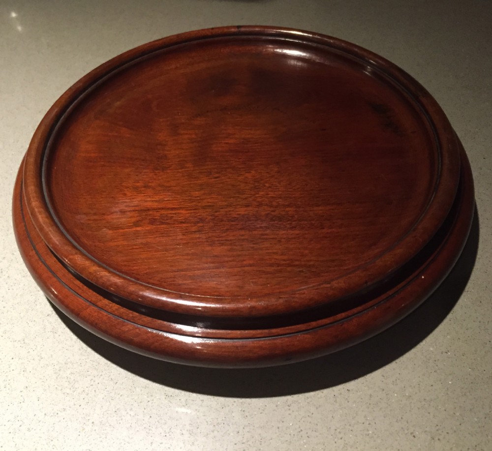 A large Georgian mahogany coaster with casters