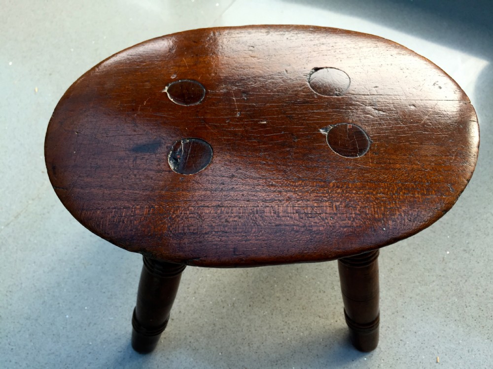 A fabulous early 19th century fruitwood candle stool