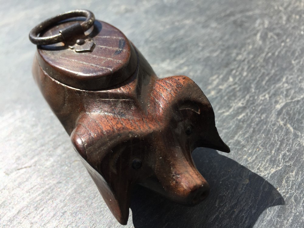 An antique snuff box in the form of a pig