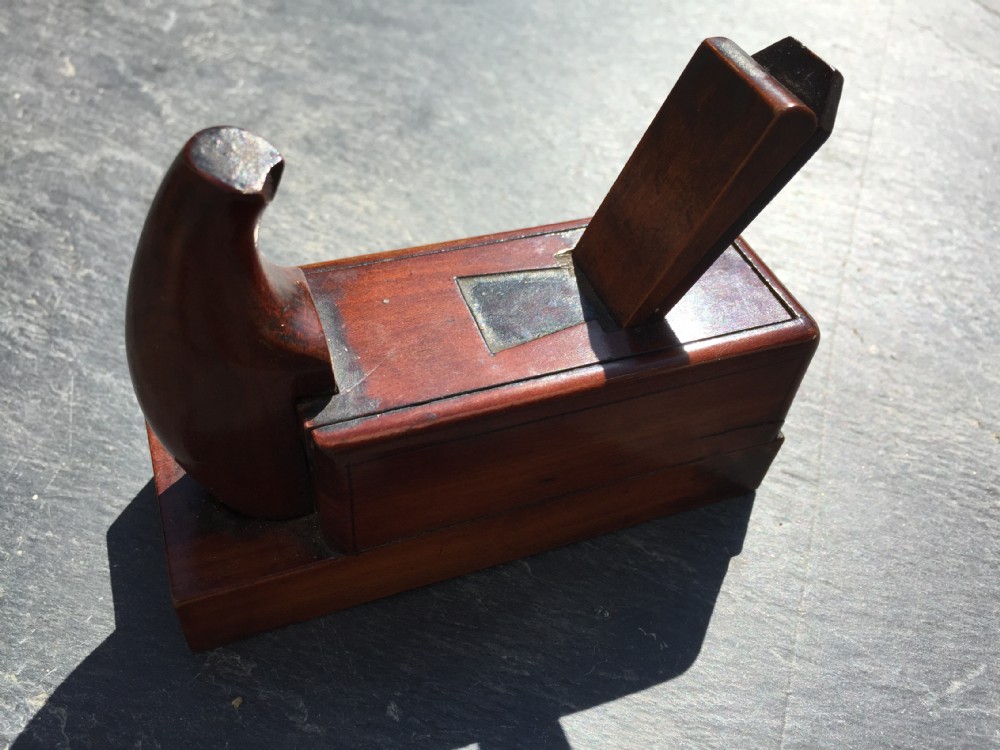 A lovely  quality fruitwood antique snuff box in the form of a plane.