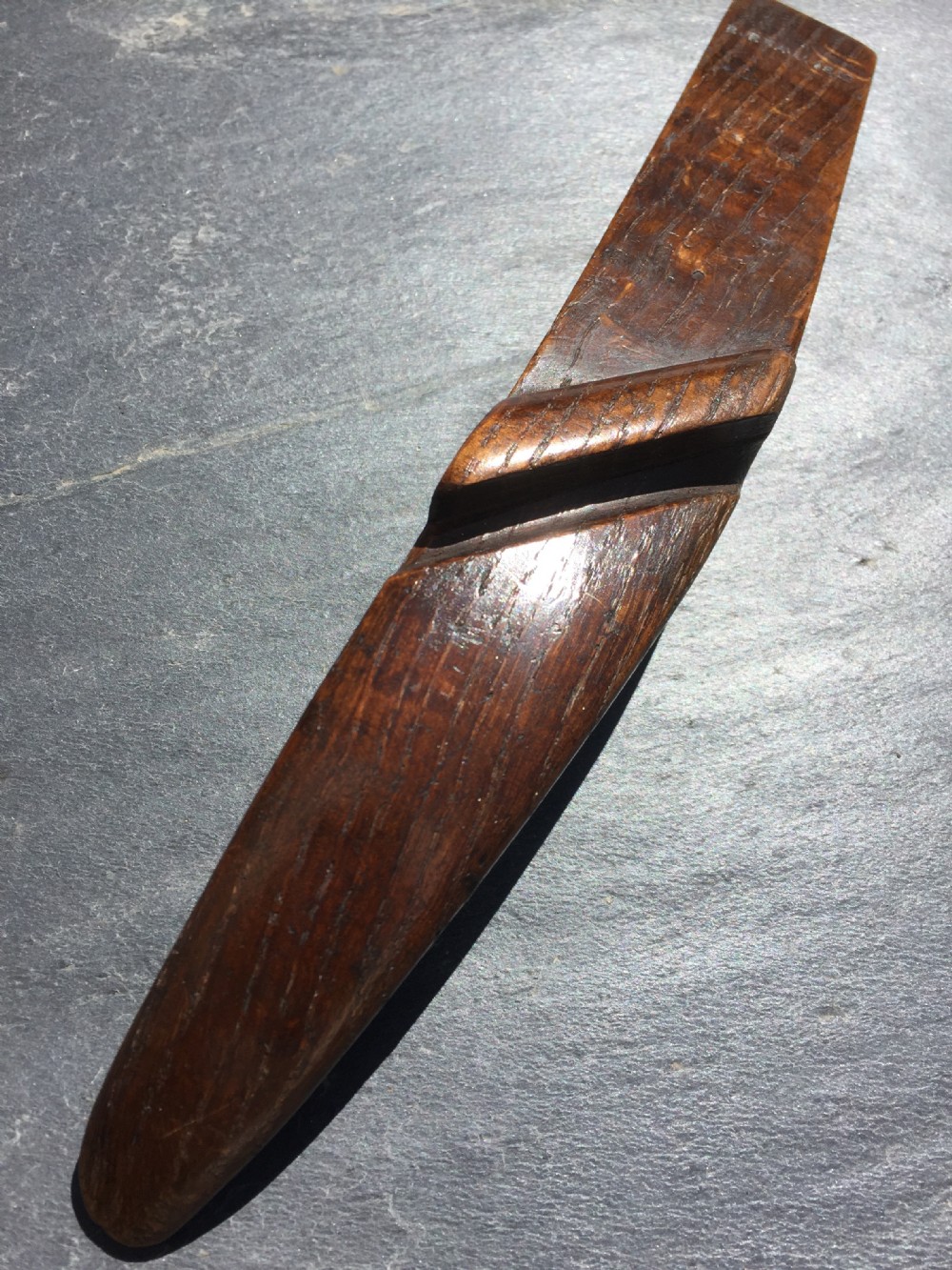 An  antique oak knitting sheath dated 1812