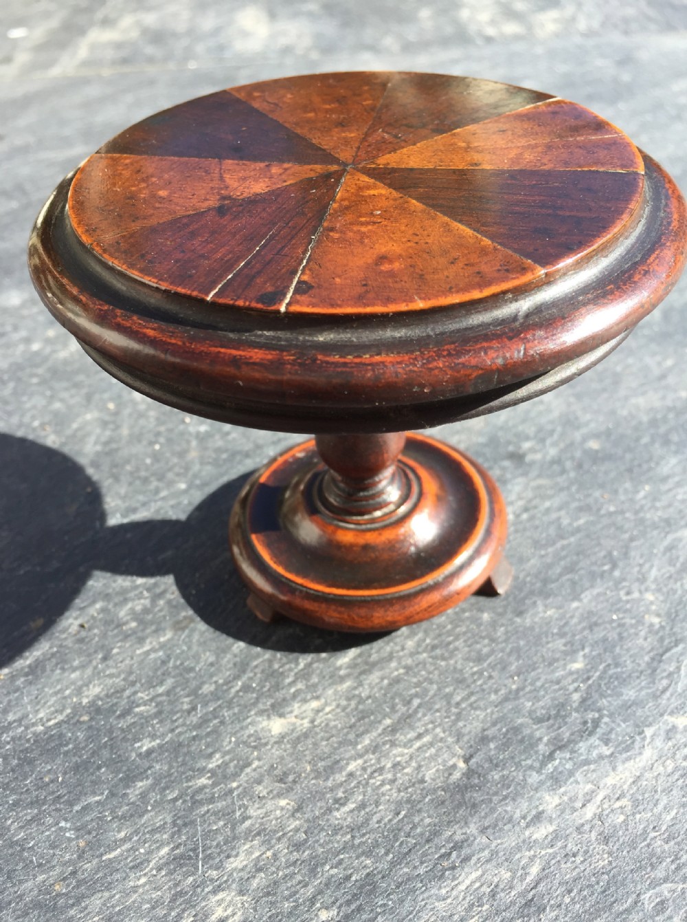 A 19th century mini tilt top table