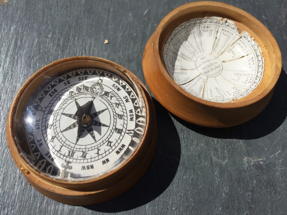 An antique sundial and compass