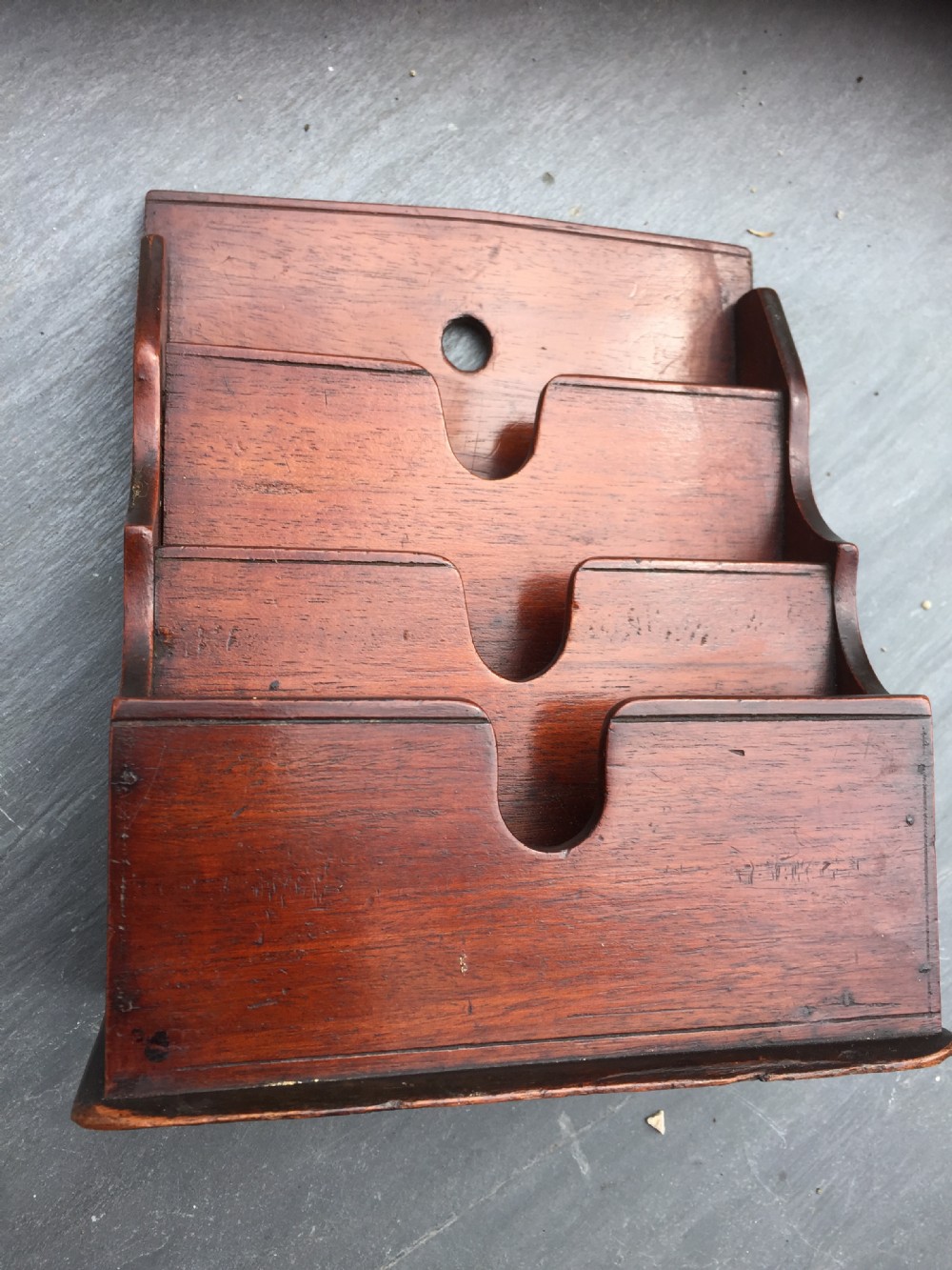 A small antique stationery rack