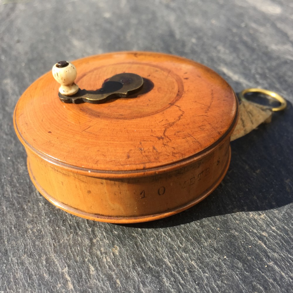 A lovely 19th century boxwood tape measure