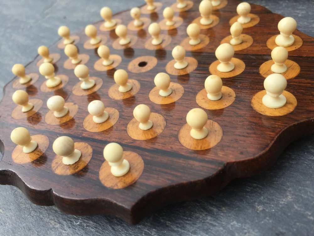 An unusual 19th century rosewood solitaire board