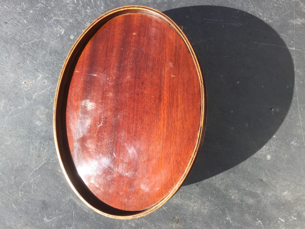 A  SMALL Georgian mahogany  oval tray