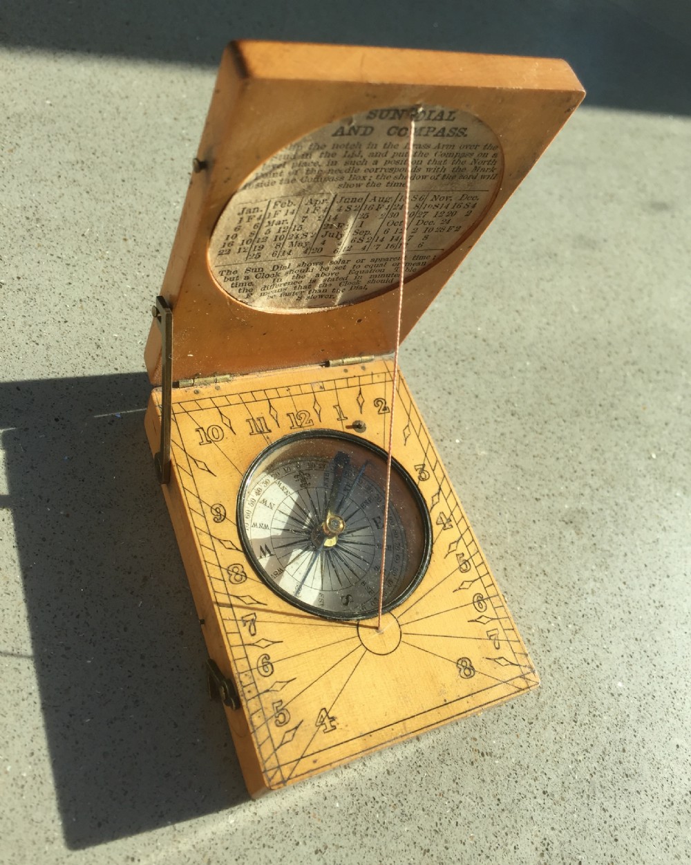 A Victorian sundial and compass