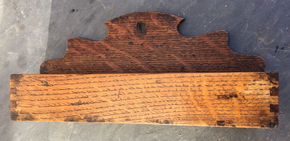 A late Victorian oak wall pocket