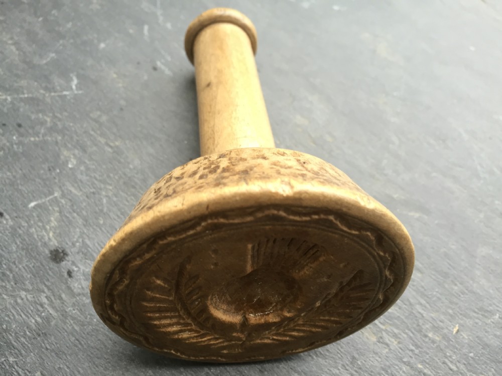 Antique butter stamp with a thistle