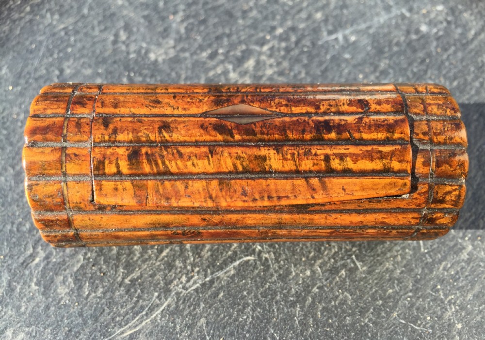 An early to mid 19th century snuff box, cylindrical in shape
