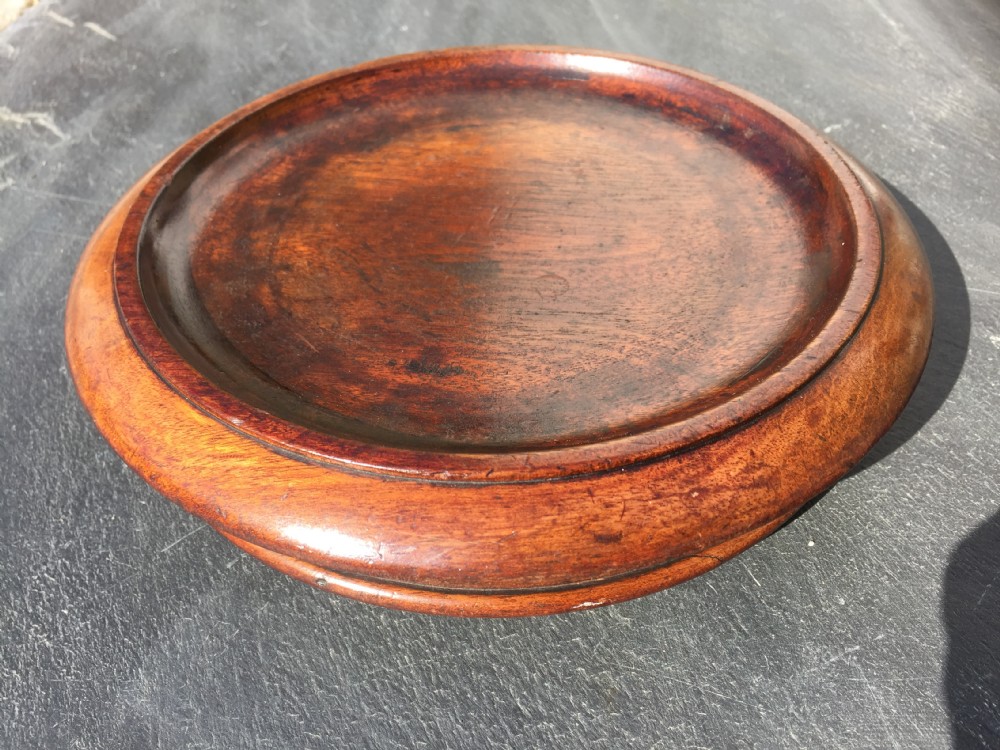 A large antique mahogany Wine Coaster with casters