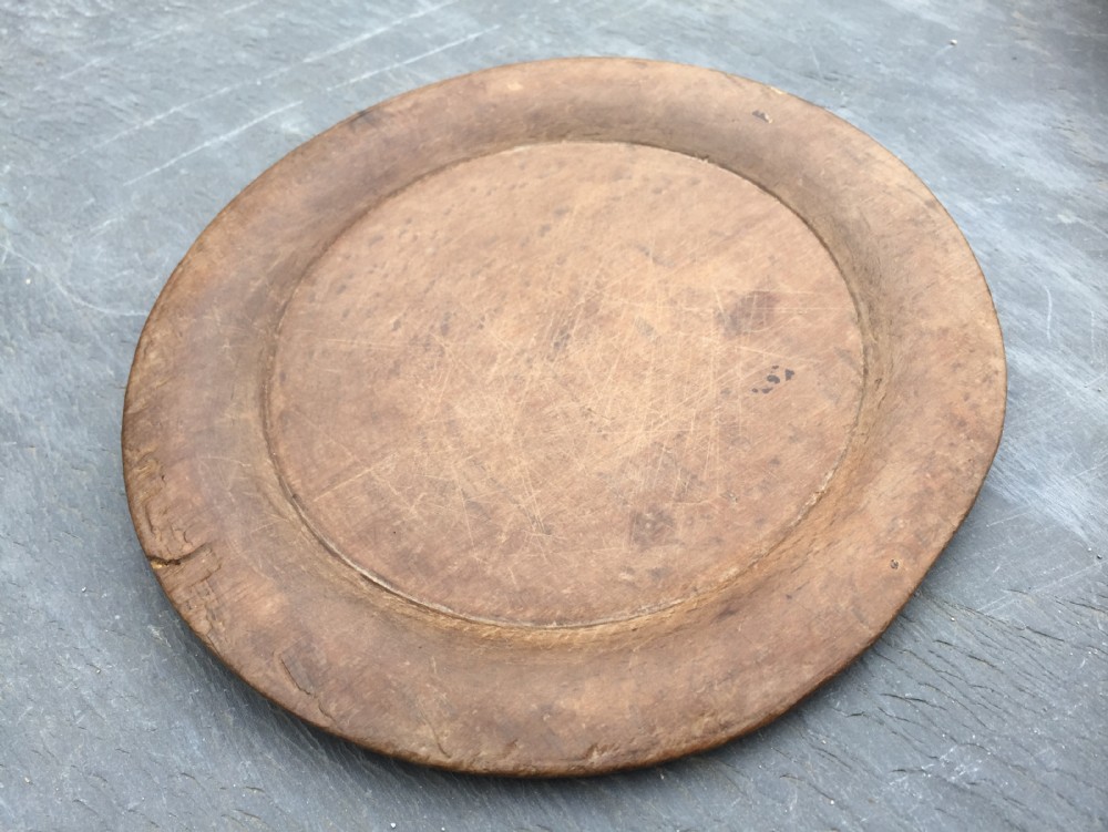 An early 19th century small sycamore platter