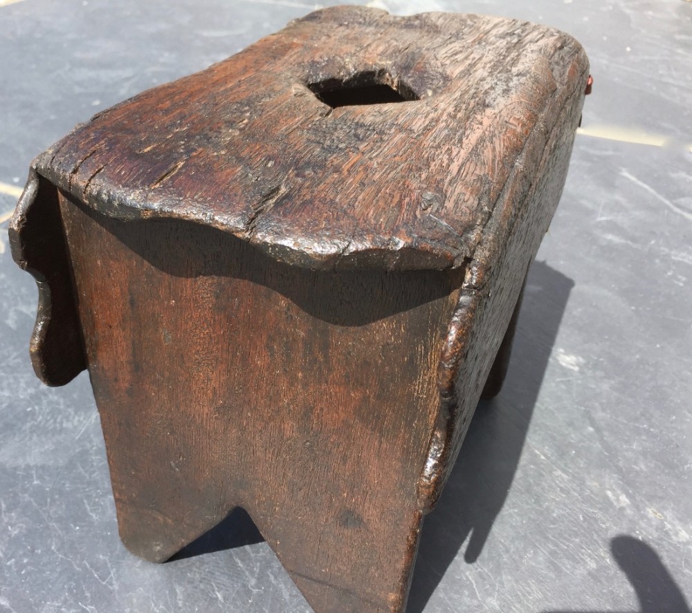 An early 1700's country oak stool