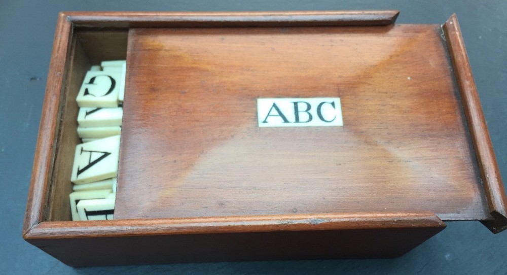 Antique Mahogany Boxed Bone Alphabet set