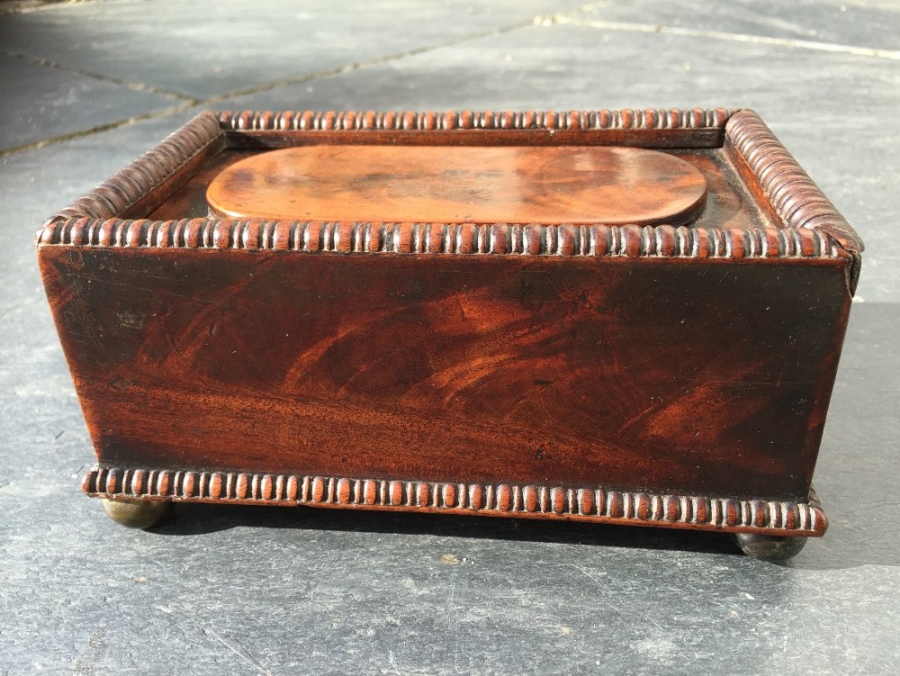 A fine Regency flame mahogany table box 