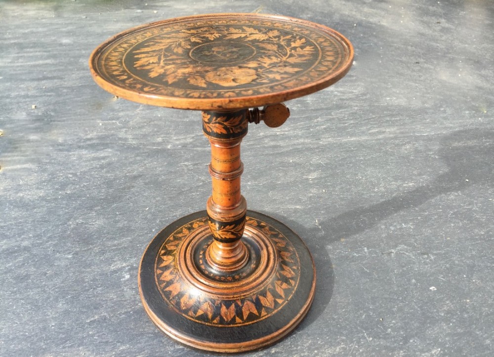 A very unusual early 19th century painted candle stand 