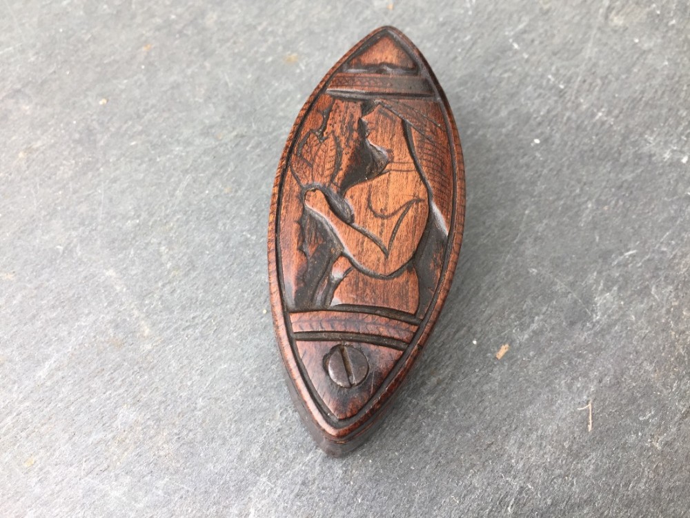 A 19th century navette shaped french carved snuff box 