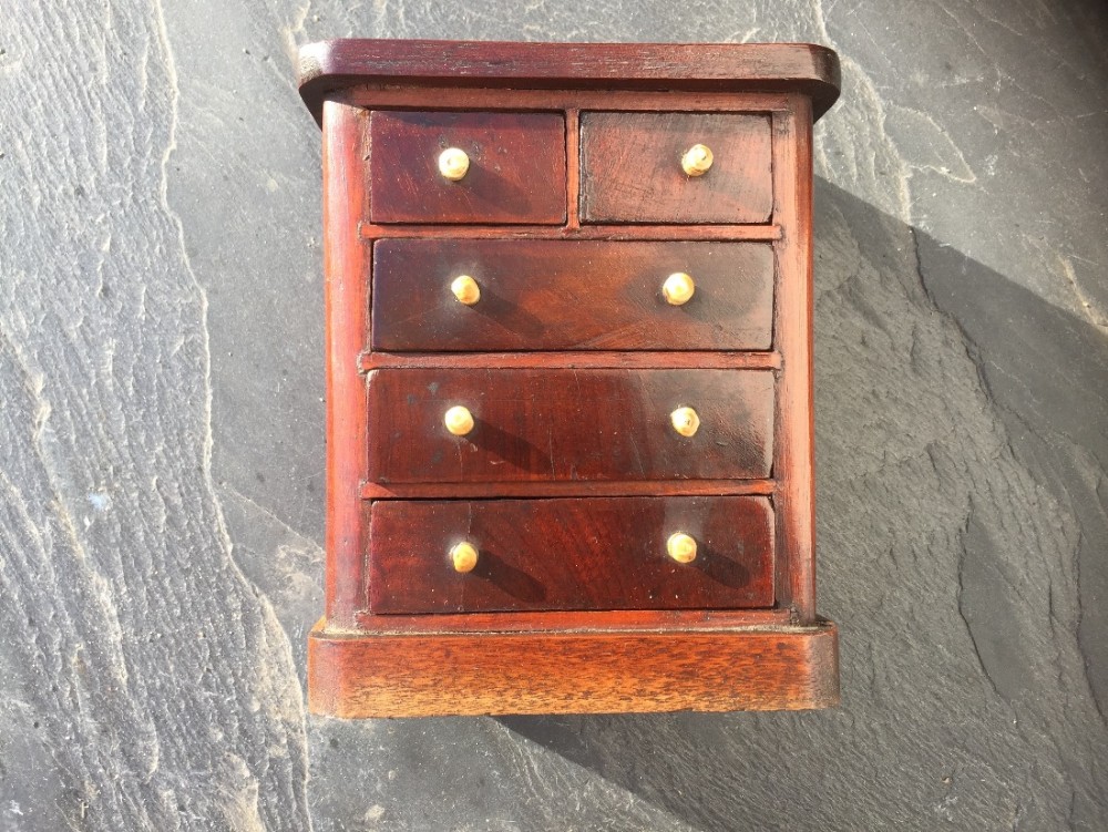 A small 19th century mahogany mini chest of drawers 