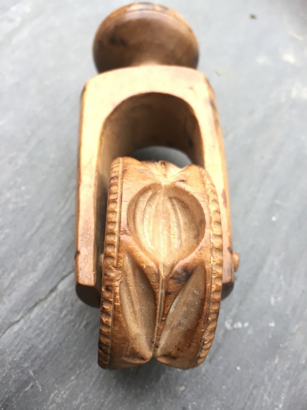 A 19th century sycamore carved butter roller and pastry marker