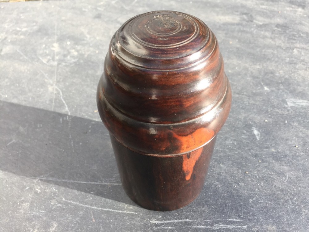 An unusual 19th century treen bottle case turned from lignum vitae