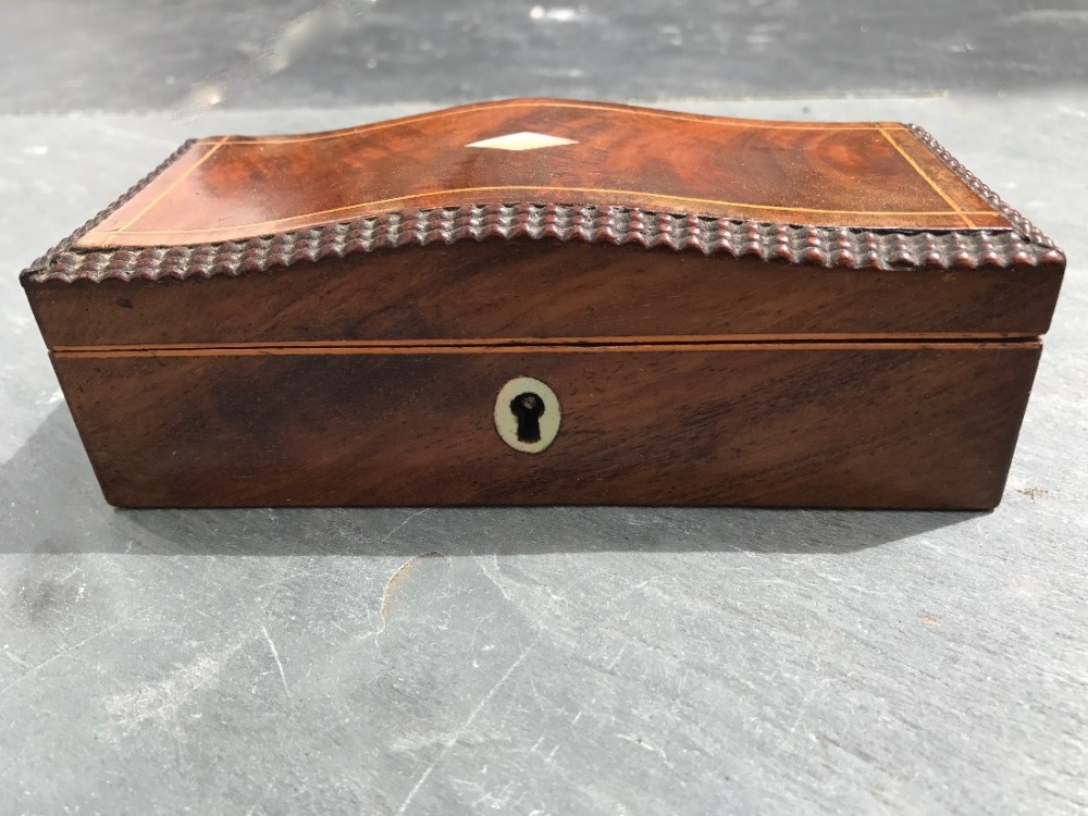 A small early to mid 19th century flame mahogany box with domed lid